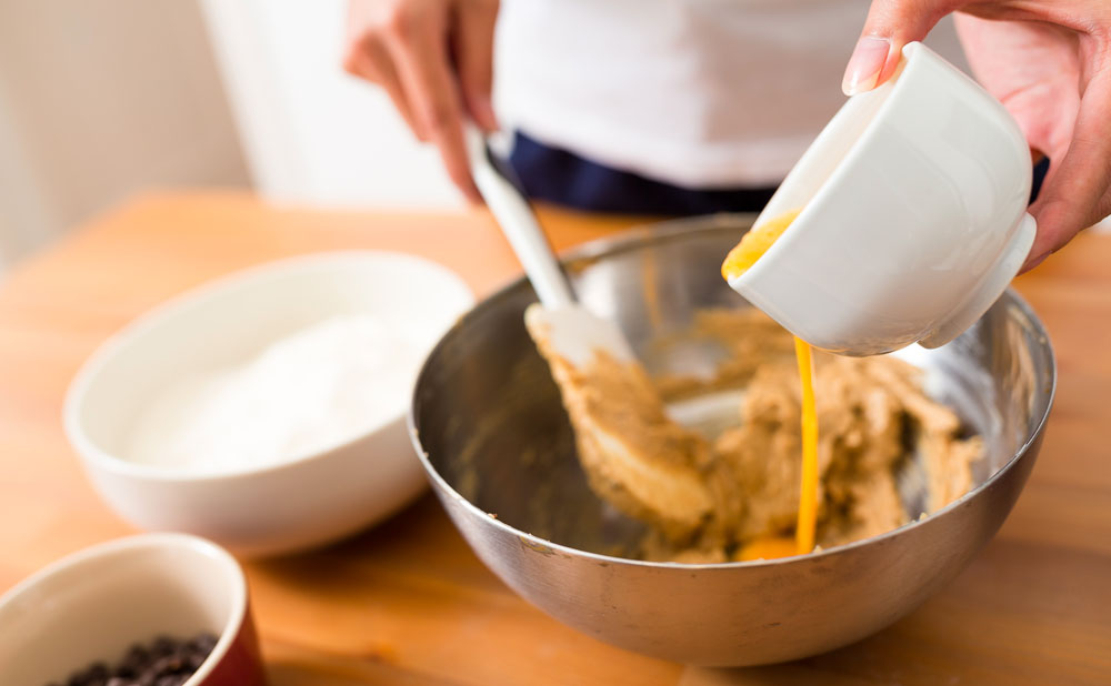 Mixing space cookie dough with cannabis butter