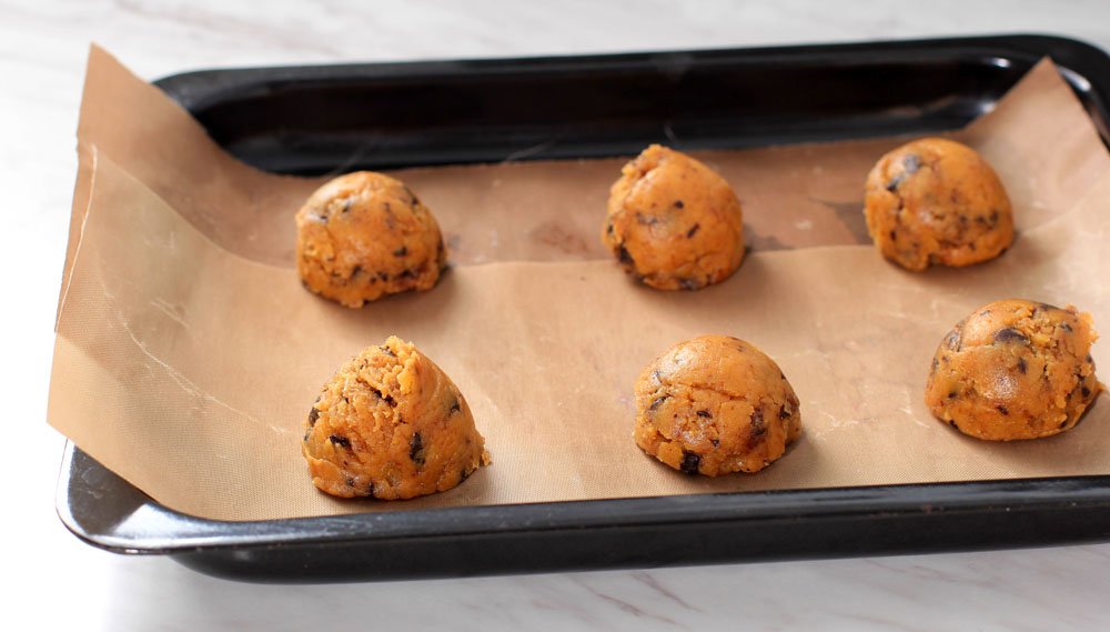 Putting space cookies into the oven cannabis baking